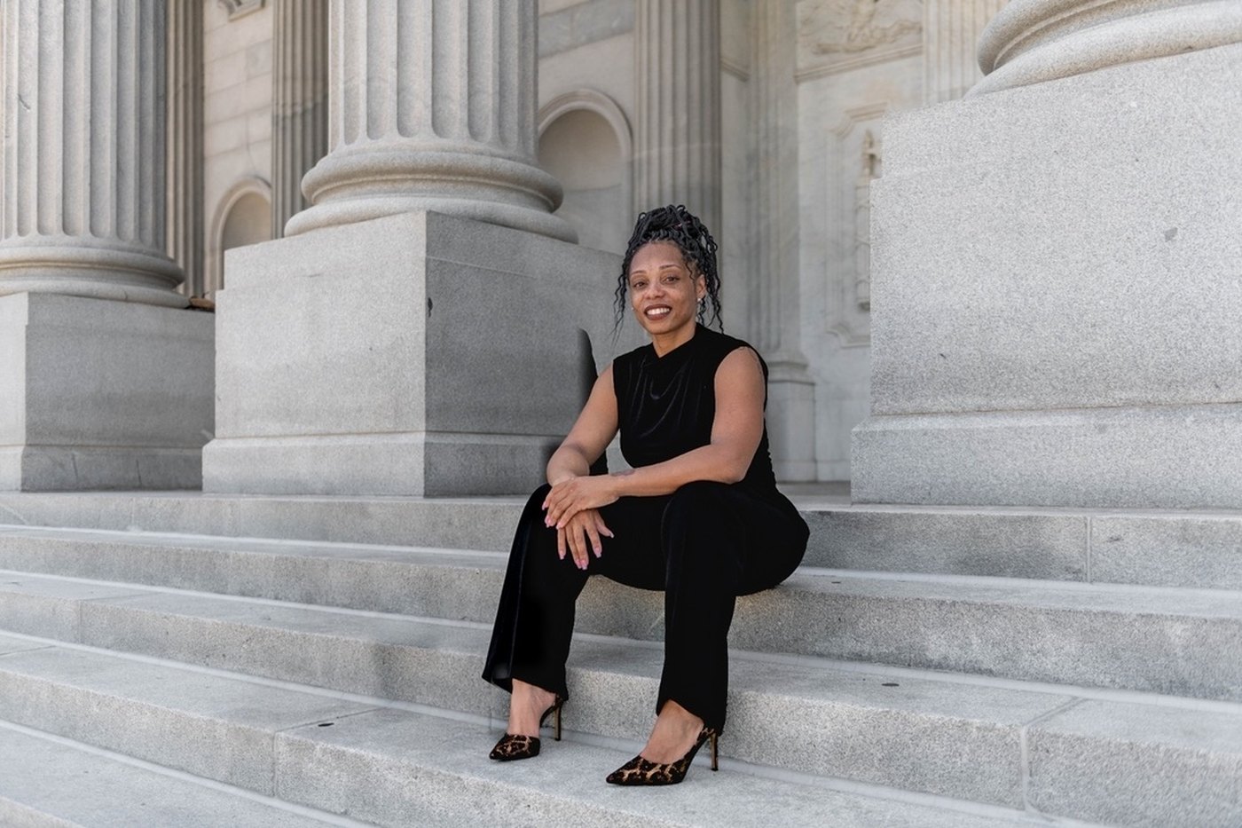 Taquoia Beals seated on the steps of the South Carolina State House in Columbia